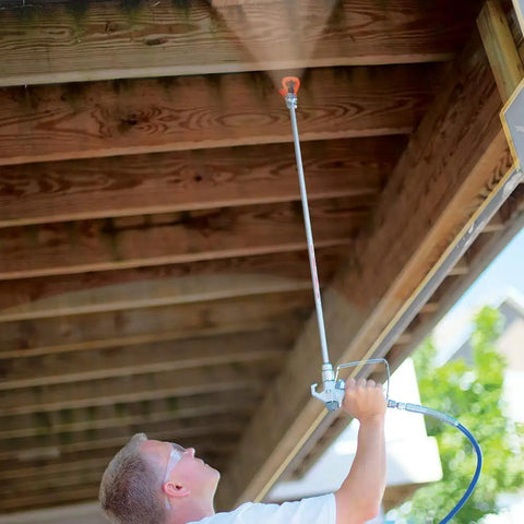 Man using 30 Inch Tip Extension With RAC V Guard For Sprayers, Great For Ceilings And Eaves, Helps You Stay Off Ladders