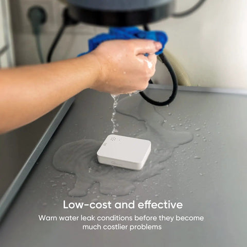 Smart Water Leak Detector 4 Pack With Zigbee Hub Kits Leak Alarm Works With Alexa And Google Home Ultra Sensitive Water Drip Alerts shown detecting water under sink on a surface with hand pouring water.