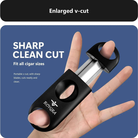 Front view of a Royga cigar cutter with stainless steel blades and black housing, held in a hand; enlarged V-cut design and logo visible