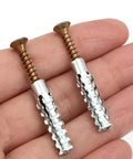 Close-up of Heavy Duty Wall Anchor Expansion Bolts with Self Tapping Screws and Drilling Plugs, serrated expansion nails in hand