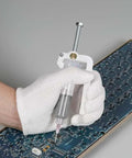 White-gloved hand using Effortless Solder Flux Gun For Precision Paste Dispensing Handheld Flux Extruder And Needle Dispenser For Electronics Soldering