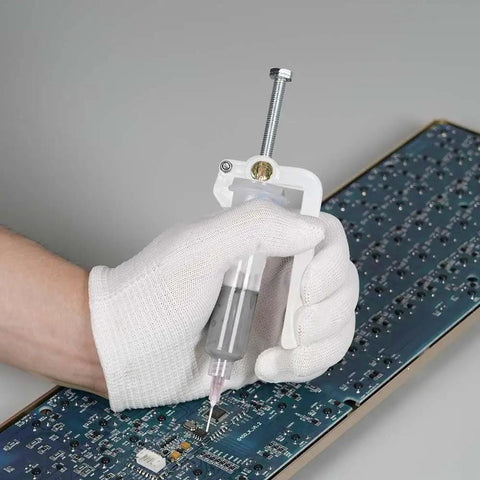 White-gloved hand using Effortless Solder Flux Gun For Precision Paste Dispensing Handheld Flux Extruder And Needle Dispenser For Electronics Soldering