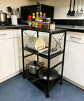 3-Tier Black Storage Shelf With Industrial X-Frame Design For Books, Decor, Baskets And Kitchen Essentials in a kitchen corner