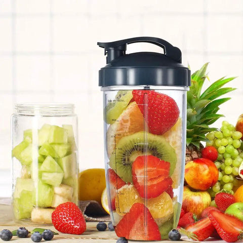 Two 32oz Replacement Blender Cups With To Go Lids For NutriBullet 600W And Pro 900W filled with colorful fruit, next to a fruit jar.