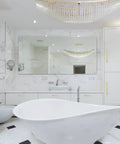 Modern bathroom with white marble, elegant chandelier, and gold cabinet handles from 10 Inch Brushed Brass Cabinet Pulls 30 Pack Square Bar Kitchen Handles Gold Hardware For Cabinets And Drawers Easy Install Durable Metal Pulls For Modern Farmhouse And Contemporary Kitchens.