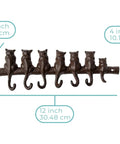 Hella Tough Cast Iron Wall Hook Rack With Seven Cute Cat Designs For Coats Keys And Hats, measuring 12x4 inches.