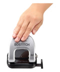 Hand pressing EZ Squeeze Reduced Effort Two Hole Punch For Home Office With No Jam Technology, durable metal construction, compact design