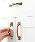 Old School Brass Cabinet Pulls 3 Inch 76mm 10 Pack Classic Handles For Kitchen Cabinets Drawers Dresser Bedroom Vanity Cupboard Solid Metal Hardware With Two Screw Sizes Included installed on white cabinet drawers.