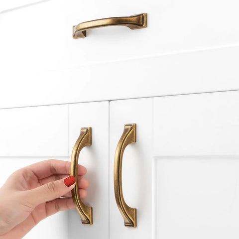 Old School Brass Cabinet Pulls 3 Inch 76mm 10 Pack Classic Handles For Kitchen Cabinets Drawers Dresser Bedroom Vanity Cupboard Solid Metal Hardware With Two Screw Sizes Included installed on white cabinet drawers.
