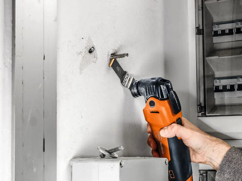 Using Starlock Plus E Cut Carbide Pro Saw Blade TiN Coated for precise cutting of metal components on a wall installation