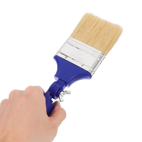Hand holding Pro Grade Adjustable 2.5 Inch Paddle Paint Brush With 270 Degree Angled Flat Tip for Oil and Latex Paint