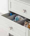 Open drawer with 20 Pack Brushed Satin Nickel Cabinet Knobs And Pulls, 1 Inch Single-Hole Drawer Handles, visible items inside.