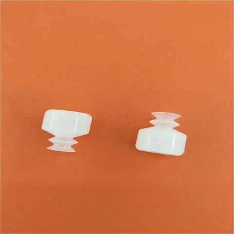 Built Like A Tank Double Industrial Vacuum Suction Cup With Automatic Chuck For Robotic Manipulators And No Sweat Production Line Work Gets Done Right In Dp Four Five Pack, two small white suction cups on an orange background.