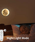 Sleeping child with Dimmable Moon Wall Sconce With Remote, Plug-In LED Wall Light, 9.5 Inch Black Indoor Wall Lamp in night mode