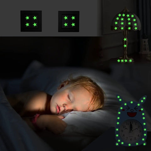 Sleeping child with Glow In The Dark Stars And Planets Ceiling Decals, luminous stars on lamp and clock, warm bedroom glow