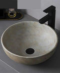 USZWBY Round Bathroom Vessel Sink - Modern Countertop Washbasin for Indoor & Outdoor Use Stylish Household Vanity Basin for Balcony & Bathroom - Durable & Easy to Clean viewed from the side with faucet.