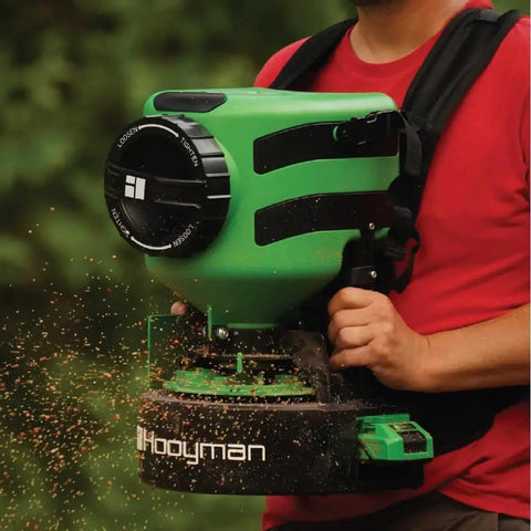 Lithium Ion Chest Spreader With Harness System, Adjustable Feed Rate, 24 Volt Power, 35 Pound Hopper in use for seeding