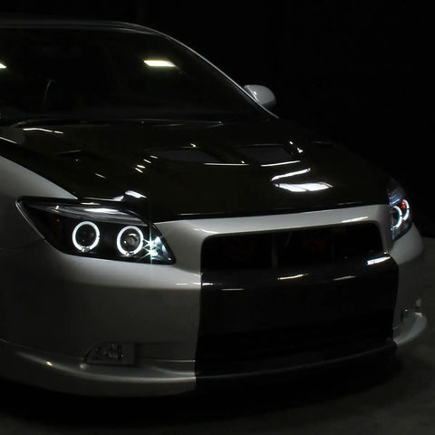 2005 To 2010 Scion tC LED Halo Projector Headlights Upgrade Kit With Black Housing And Angel Eye Rings fitted on a car