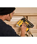 Professional 18 Gauge Brad Nailer With Rear Exhaust Blasts Dust Away Tight Trigger used for trim work on wood paneling.
