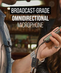 Man using SmartLav Plus Lavalier Microphone for Smartphones and Tablets With Clip-On Mount and Foam Pop Shield in a cafe setting.