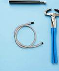 Heavy Duty Garment Steamer Hose Replacement, 1 Meter High Temp Flexible Steam Tube with tool on light blue background