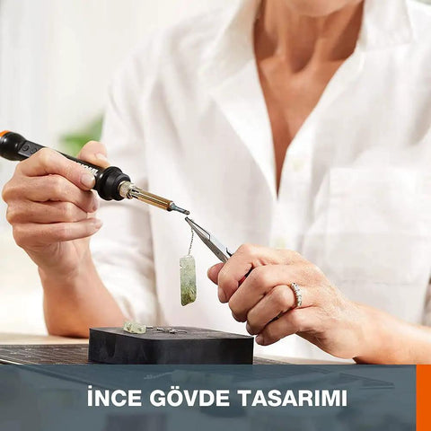 A person using the Top Tier Cordless Pen Engraver And Digital Soldering Iron Kit With Sweet 20V Battery for jewelry making.