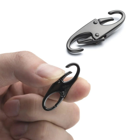 Person holding a Double Small Carabiner Clips For Zipper Replacement And Theft Deterrent, 1.5 inch black clip in hand.