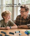Father and son with Wheels And Axles Set For City Cars And Trucks 118 Piece Building Block Parts Kit on table, smiling.