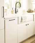 Square Matte Black Cabinet Knobs About An Inch And A Quarter Wide For Kitchen Cabinets on stylish white cabinetry.