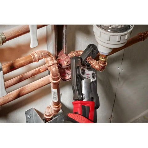 Pro Grade Force Logic Press Tool Bundle with Half Inch to One and a Quarter Inch CTS V Pivoting Ring Kit in use on copper pipes