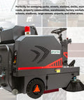 Badass 49 Inch Ride On Industrial Floor Sweeper Machine With 26 Gallon Hopper And Water Dust Control Tank shown from side angle with sweeping brush.