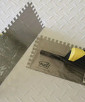 Beast Pro Grade Square Notch Trowel for spreading, stainless steel blade, ergonomic yellow rubber handle, packaging view