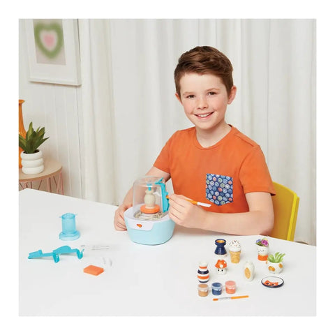 Child using Awesome Mini Pottery Studio Kit For Kids 8 And Up 26 Piece DIY Air Dry Clay Set with pottery tools and clay projects