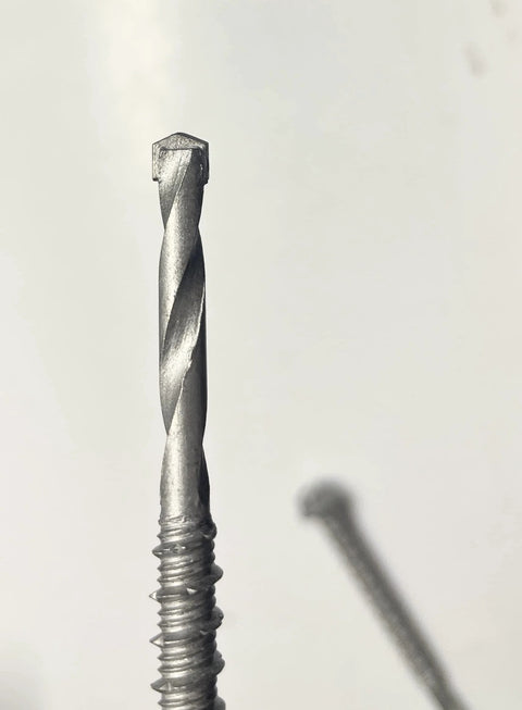 Close-up of Self Drilling Concrete Screws Quarter Inch By Three Inch Steel With Tungsten Carbide Tip 15 Pack No Pre Drilling Needed