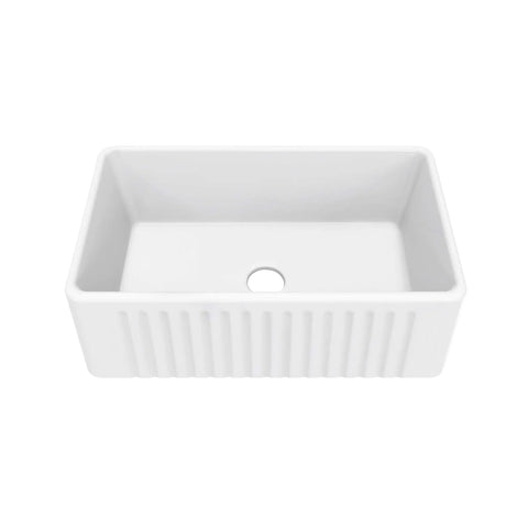 Top view of a rectangular white ceramic kitchen sink with a central drain hole