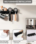 Wall Mounted Espresso Tamper Holder And Coffee Station Organizer With 54mm Portafilter Storage Rack For Home Or Office Barista Setup Durable ABS Plastic Construction With Detachable Anti Slip Silicone Mats And Easy Wall Mounting with self-adhesive installation steps displayed.