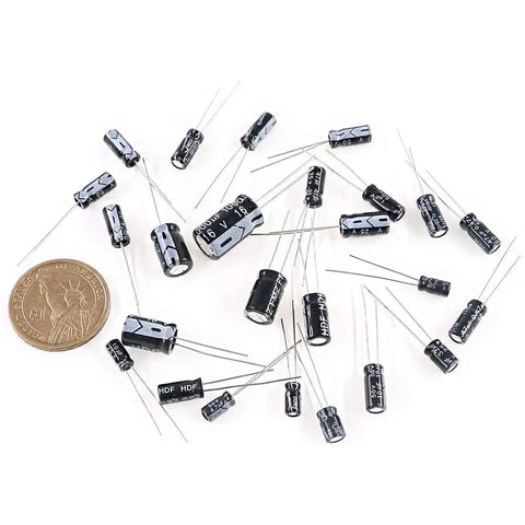 545Pcs Electrolytic Capacitors Assorted Kit With 10V 16V 25V 50V Range Labeled 0.1uF To 1000uF with coin for size reference