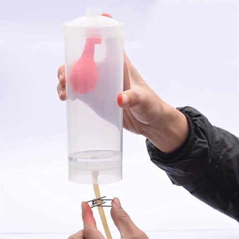 Person demonstrating Pendulum Motion Lab Kit With Kinetic And Potential Energy Experiments, showing balance and pressure tool.