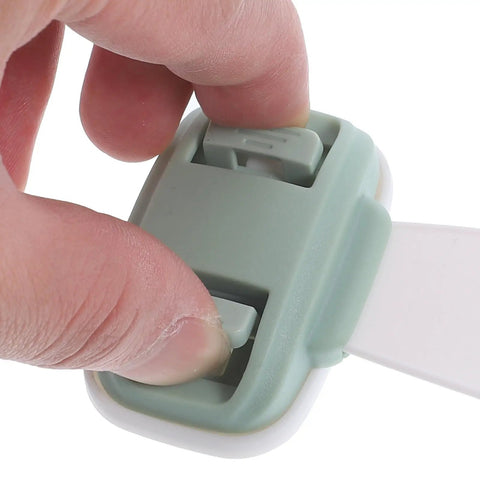 Close-up of hand using Kid Safe Cabinet Door and Drawer Latches With Double Press Buckle Design ABS Material Proofing Locks