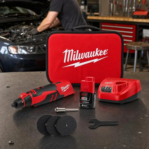 Badass Brushless Cordless Rotary Tool Kit With Whopping Variable Speed Range 5000 To 27500 Rpm And Redlink Intelligence For Cutting Grinding Sanding And Detail Work Built Tough For Hardcore Tradesmen displayed with accessories on a workbench.