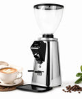 Built Like A Tank Espresso Bean Grinder With 64Mm Flat Burrs And 350W Motor For Straight Up Smooth Pulls Silver Portafilter Dosing Fork Included shown with a coffee cup and beans.