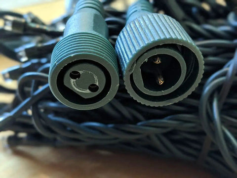 Close-up of connector plugs for 33Ft 100 LED Outdoor Waterproof String Lights Warm White For 12V Low Voltage Landscape Lighting