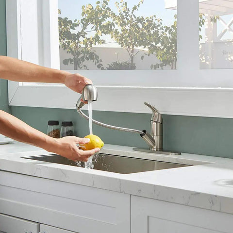Person uses Stainless Steel Brushed Nickel One Handle Pull Out Sprayer Bar Kitchen Faucet For Small Sinks With Escutcheons And Single Hole Mount