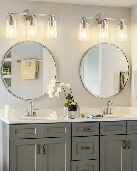 Three Light Bathroom Vanity Light Fixture In Brushed Nickel With Clear Glass Shades Over Mirror Wall Sconce No Fuss Easy To Install