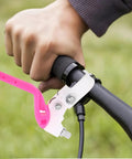 Person using Kids Bike Brake Lever Set on black handlebar, rosy color, 2 to 2.3 cm diameter, replacement plastic levers.