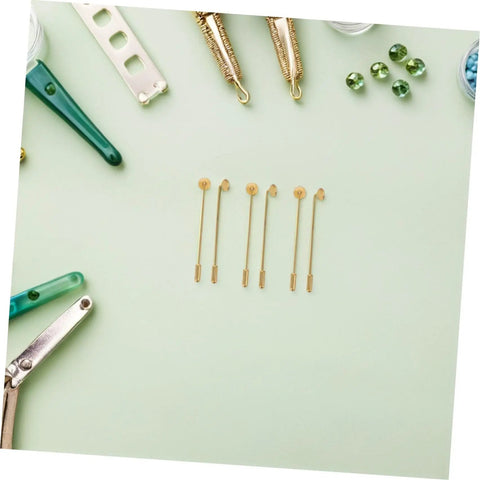 Awesome 50 Sets Copper Flat Round Blank Base Brooch Pins With Secure Safety Backs perfect for DIY jewelry making displayed on a green background.
