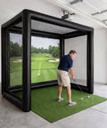 Man practicing in Portable Indoor Golf Practice Enclosure With Airtight PVC Screen Cage For Garage Or Backyard, Quick Inflate Setup