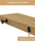 Heavy Duty Invisible Floating Wall Shelf Brackets Eight Inch Black Metal Shelf Supports installed in wooden shelf