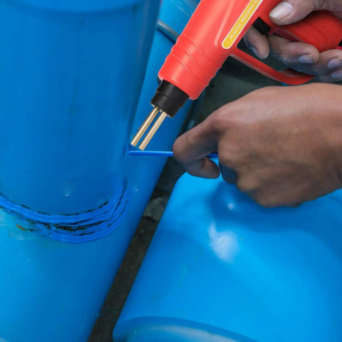 Using 70W Portable Handheld Plastic Welding Kit With 110V US Plug to weld blue plastic pipes, close-up view