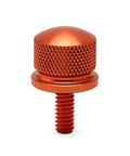 Knurled Aluminum Rear Seat Screw With Rubber Ring For Quarter Inch Twenty Thread Fits Touring Sportster Softail Dyna Street Glide Road King Fat Bob 1996 2025 Orange, shown in close-up view